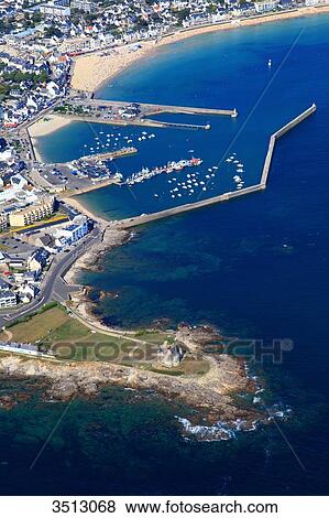 Stock Photo - France, Western France, aerial view of Quiberon peninsula. Castle of Quiberon. Harbour in the background.. Fotosearch