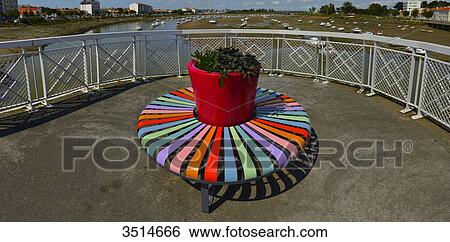 France, Western France, terrace and colorful circular bench in front of the port of St. Gilles Croix de Vie View Large Photo Image Stock Photograph - France, Western France, terrace and colorful circular bench in front of the port of St. Gilles Croix de Vie. Fotosearch