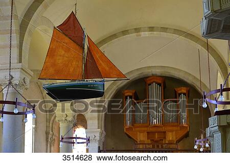 Stock Photo - France, Western France, Vendee, votive offerings in the form of a model of a sailboat in the Holy Cross Church in Saint-Gilles-Croix-de-Vie. Fotosearch