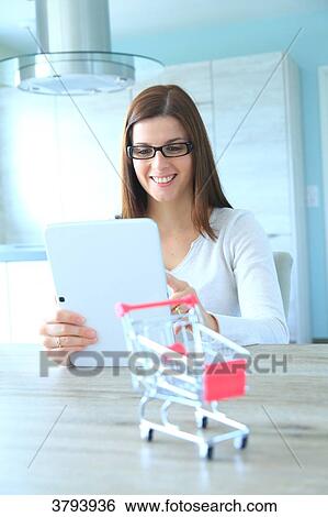 Stock Photograph - France, woman at home.. Fotosearch