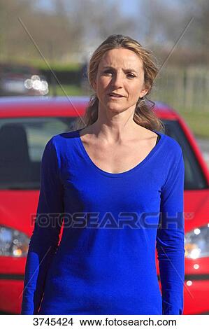 France, woman in front of her car. View Large Photo Image Picture - France, woman in front of her car.. Fotosearch