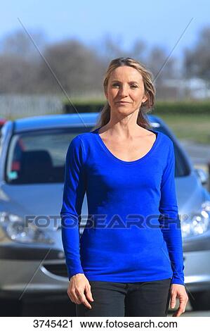 France, woman in front of her car. View Large Photo Image Stock Image - France, woman in front of her car.. Fotosearch