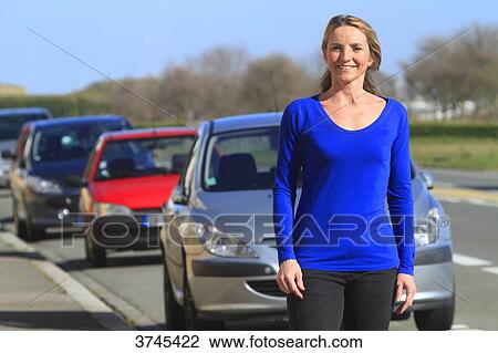 France, woman in front of her car. View Large Photo Image Stock Image - France, woman in front of her car.. Fotosearch