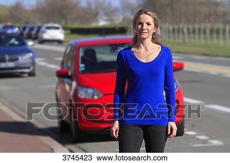 France, woman in front of her car. View Large Photo Image Stock Image - France, woman in front of her car.. Fotosearch