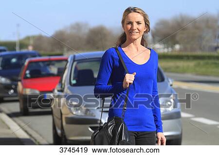 France, woman in front of her car. View Large Photo Image Stock Photo - France, woman in front of her car.. Fotosearch
