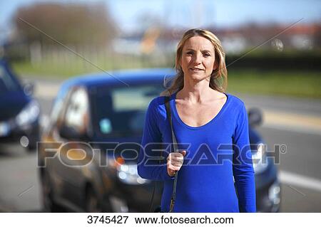 France, woman in front of her car. View Large Photo Image Stock Photo - France, woman in front of her car.. Fotosearch