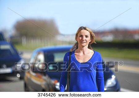France, woman in front of her car. View Large Photo Image Stock Photograph - France, woman in front of her car.. Fotosearch