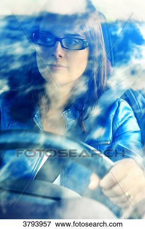 Stock Photo - France, woman in her car.. Fotosearch