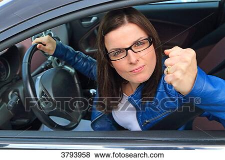 Stock Photo - France, woman in her car.. Fotosearch