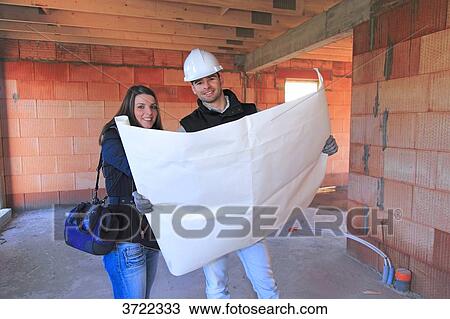 France, young architect and customer in a house in construction. View Large Photo Image Stock Image - France, young architect and customer in a house in construction.. Fotosearch