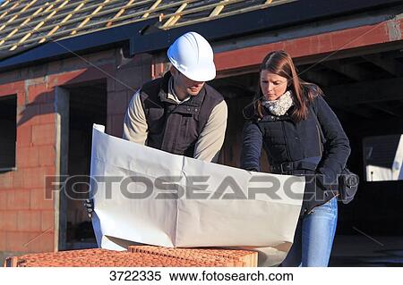 France, young architect and customer in a house in construction. View Large Photo Image Stock Photography - France, young architect and customer in a house in construction.. Fotosearch