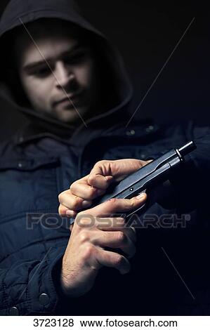 France, young man using a gun View Large Photo Image Stock Photo - France, young man using a gun. Fotosearch