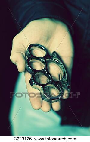 France, young man with brass knuckles View Large Photo Image Stock Photograph - France, young man with brass knuckles. Fotosearch