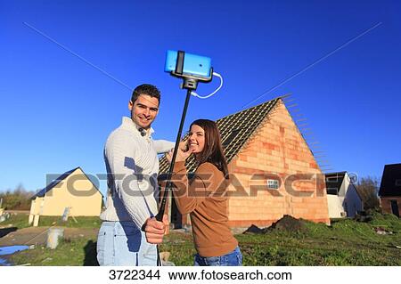 France, young person couples and house in construction. View Large Photo Image Picture - France, young person couples and house in construction.. Fotosearch