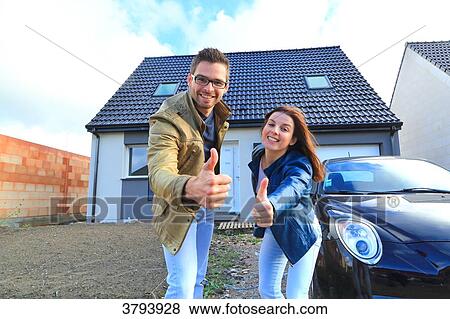 France, young person couples in front of his house. View Large Photo Image Stock Photo - France, young person couples in front of his house.. Fotosearch