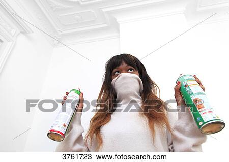France, young woman at home with spray. View Large Photo Image Stock Image - France, young woman at home with spray.. Fotosearch