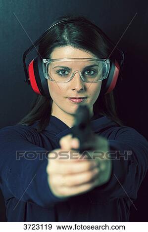 France, young woman with a gun. View Large Photo Image Stock Photo - France, young woman with a gun.. Fotosearch