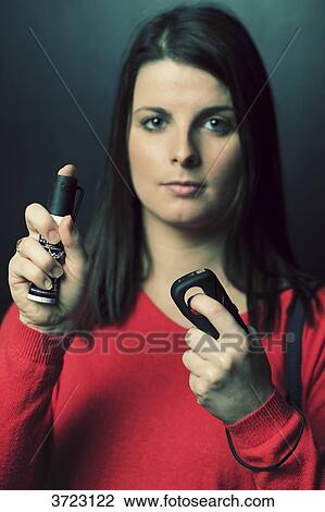 France, young woman with lachrymatory aerosol and electric shocker View Large Photo Image Stock Image - France, young woman with lachrymatory aerosol and electric shocker. Fotosearch
