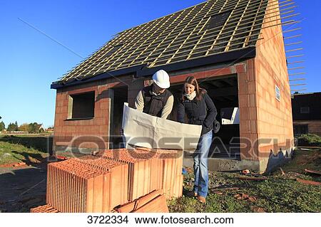 France, young working person in a house in construction. View Large Photo Image Picture - France, young working person in a house in construction.. Fotosearch