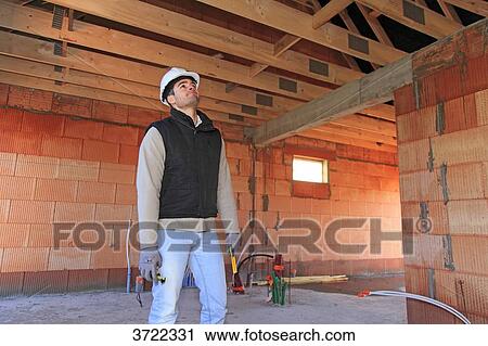 France, young working person in a house in construction. View Large Photo Image Stock Image - France, young working person in a house in construction.. Fotosearch