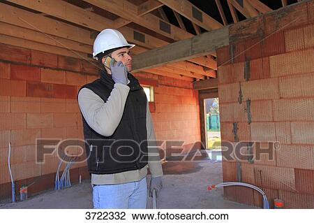France, young working person in a house in construction. View Large Photo Image Stock Image - France, young working person in a house in construction.. Fotosearch