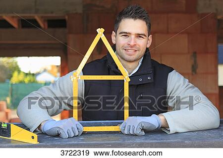 France, young working person in a house in construction. View Large Photo Image Stock Photo - France, young working person in a house in construction.. Fotosearch