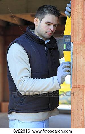 France, young working person in a house in construction. View Large Photo Image Stock Photograph - France, young working person in a house in construction.. Fotosearch