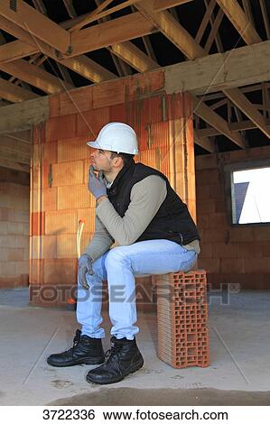 France, young working person in a house in construction. View Large Photo Image Stock Photograph - France, young working person in a house in construction.. Fotosearch