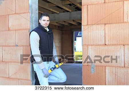 France, young working person in a house in construction. View Large Photo Image Stock Photography - France, young working person in a house in construction.. Fotosearch