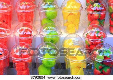 Picture - Fresh fruits in plastic glasses.. Fotosearch