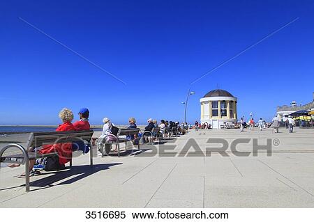Stock Photography - Germany, Lower Saxony. Borkum Island. Seaside and strollers.. Fotosearch