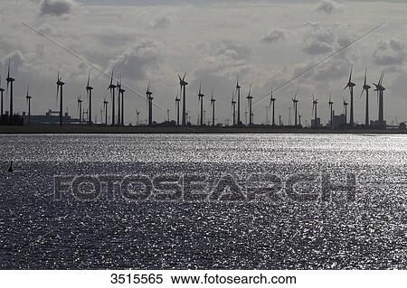 Germany. Lower Saxony. Emden. The Ems. Field of windmills. View Large Photo Image Stock Photography - Germany. Lower Saxony. Emden. The Ems. Field of windmills.. Fotosearch