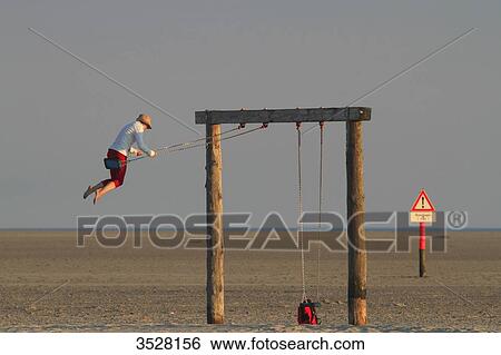 Germany, Nordfriesland, Schleswig-Holstein, Sankt Peter Ording or St Peter Ording is the biggest seaside resort in Germany. View Large Photo Image Stock Photograph - Germany, Nordfriesland, Schleswig-Holstein, Sankt Peter Ording or St Peter Ording is the biggest seaside resort in Germany.. Fotosearch