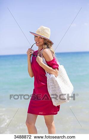 Happy blonde woman arriving at the beach View Large Photo Image Stock Image - Happy blonde woman arriving at the beach. Fotosearch