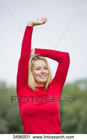 Happy blonde woman in park View Large Photo Image Stock Image - Happy blonde woman in park. Fotosearch