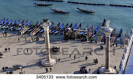 Stock Image - Italy, Venice, la Serenissima, aerial view of Venice's rooftops from the St Mark's Campanile, gondoliers pier. Fotosearch