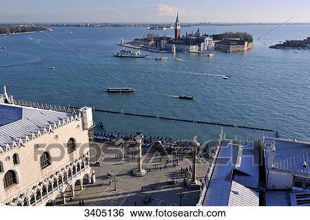 Italy, Venice, la Serenissima, aerial view of Venice's rooftops from the St Mark's Campanile. San Giorgio Maggiore island in the background View Large Photo Image Stock Photograph - Italy, Venice, la Serenissima, aerial view of Venice's rooftops from the St Mark's Campanile. San Giorgio Maggiore island in the background. Fotosearch