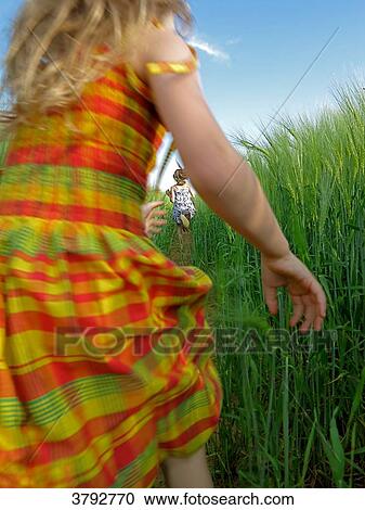 little girl running in a grain field View Large Photo Image Stock Image - little girl running in a grain field. Fotosearch