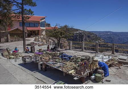 Mexico, Chihuahua State, Sierra Tarahumara, Barranco del Cobre selling handcraft at El Divisadero, in front of The Hotel Posada Barrancas, Copper Canyon, El Divisadero View Large Photo Image Picture - Mexico, Chihuahua State, Sierra Tarahumara, Barranco del Cobre selling handcraft at El Divisadero, in front of The Hotel Posada Barrancas, Copper Canyon, El Divisadero. Fotosearch