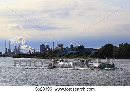 Nederlands, Ijmuiden. Canal, Tata factory, Hoogovens-Corus group. View Large Photo Image Stock Photograph - Nederlands, Ijmuiden. Canal, Tata factory, Hoogovens-Corus group.. Fotosearch