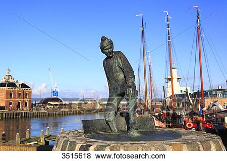 Netherlands, Friesland. Harlingen. The harbour. De Tobbedanser statue. View Large Photo Image Stock Photo - Netherlands, Friesland. Harlingen. The harbour. De Tobbedanser statue.. Fotosearch