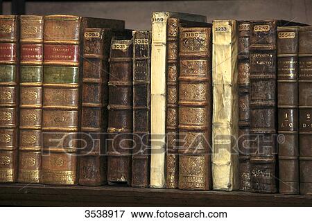 Old books in a library. View Large Photo Image Stock Photo - Old books in a library.. Fotosearch