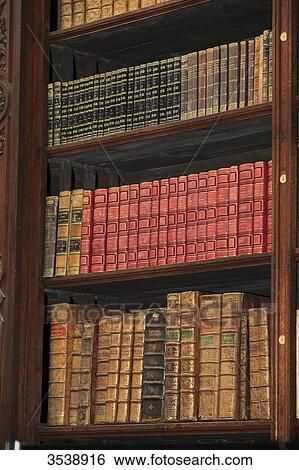 Old books in a library. View Large Photo Image Stock Photograph - Old books in a library.. Fotosearch