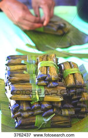 Philipins, Cebu City. Cebu Island. Suman is a rice cake originating from the Philippines. It is made from glutinous rice cooked in coconut milk, and often steamed wrapped in buli or buri palm View Large Photo Image Stock Photo - Philipins, Cebu City. Cebu Island. Suman is a rice cake originating from the Philippines. It is made from glutinous rice cooked in coconut milk, and often steamed wrapped in buli or buri palm. Fotosearch