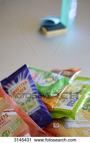 Stock Image - Photo studio, composition of different sponges, cleaning wipes and cleaning products. Fotosearch