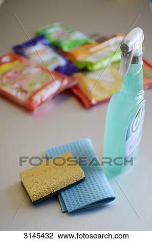 Stock Image - Photo studio, composition of different sponges, cleaning wipes and cleaning products. Fotosearch