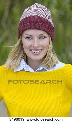 Portrait of a blonde woman in park smiling at camera View Large Photo Image Stock Photo - Portrait of a blonde woman in park smiling at camera. Fotosearch