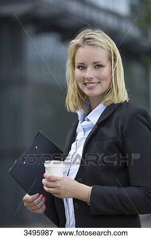 Portrait of a executive woman with coffee outdoors View Large Photo Image Stock Photo - Portrait of a executive woman with coffee outdoors. Fotosearch