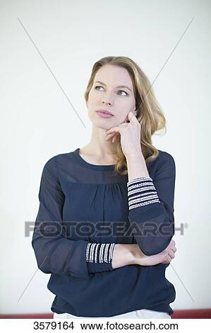 Portrait of a pensive blonde woman View Large Photo Image Picture - Portrait of a pensive blonde woman. Fotosearch