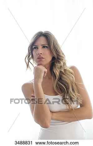 Portrait of a pensive woman with white background View Large Photo Image Stock Image - Portrait of a pensive woman with white background. Fotosearch